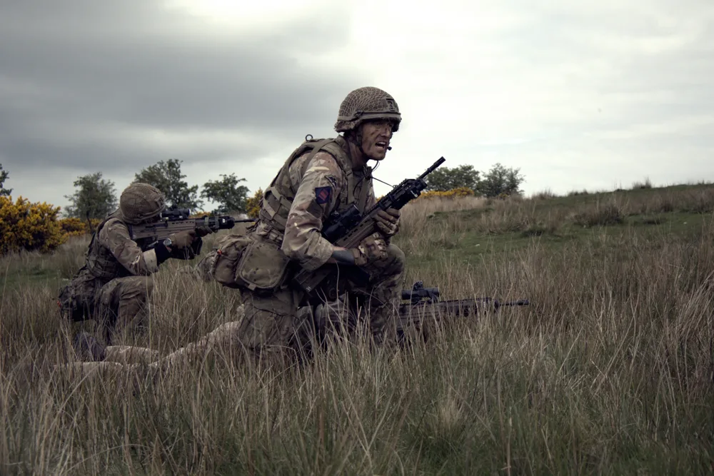 Soldiers moving across open ground