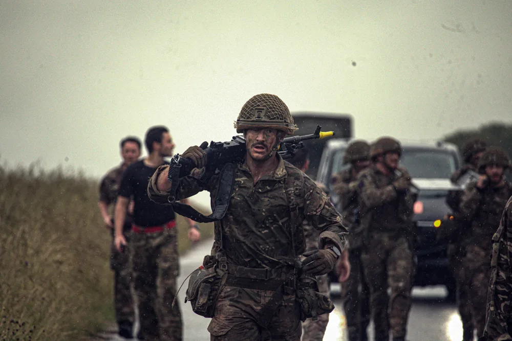 Group carrying equipment during training