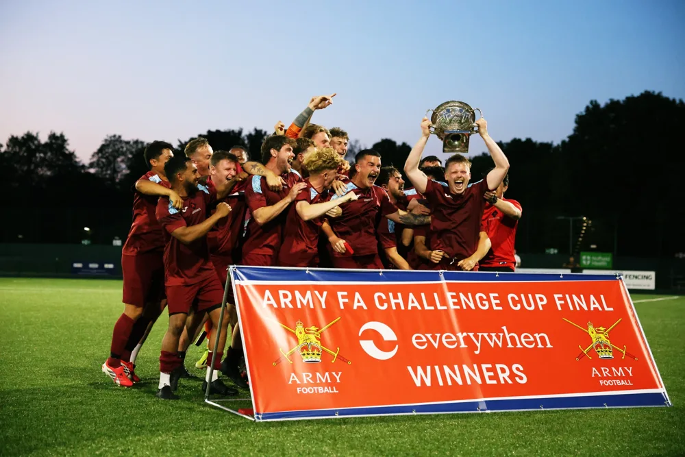 Football team celebrating with a trophy
