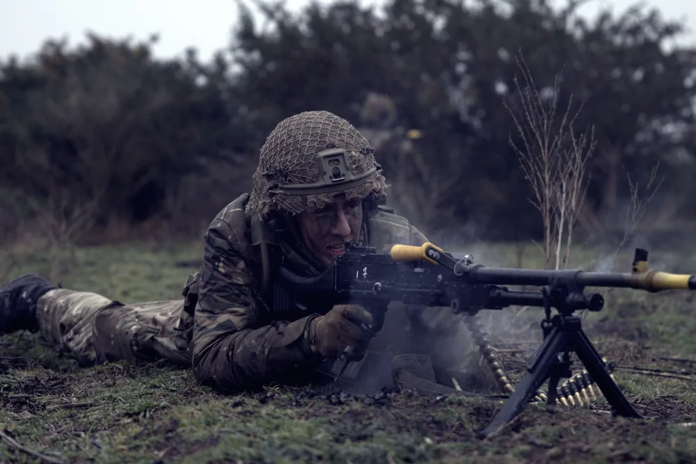 Soldier operating a machine gun during training