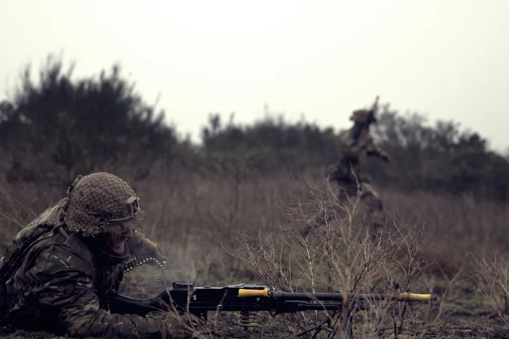 Soldiers working together in the field