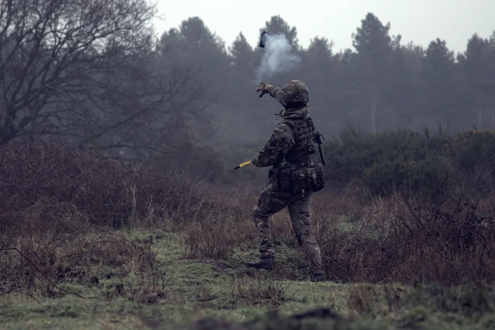 Soldier signalling across the training area