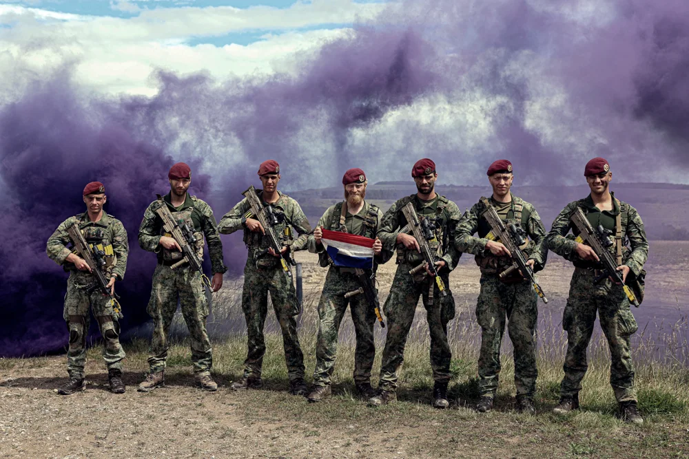 Group portrait with purple smoke