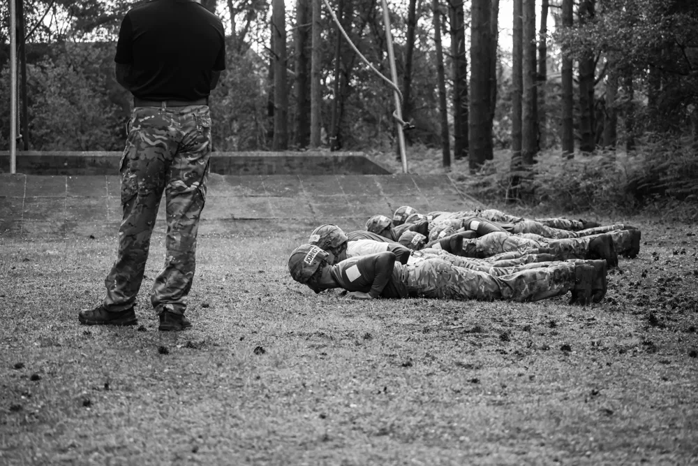 Soldiers exercising on a woodland track
