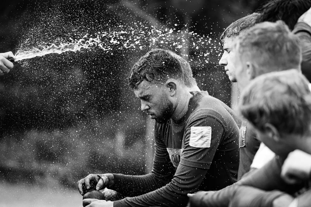 Soldier cooling down with water during training